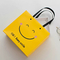 ISO Shock Resistant Smile Face Kraft Paper Bags Yellow Square Bottom Paper Bag